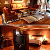 タイ・スタイルのシックなインテリアのラマ・スイート客室。