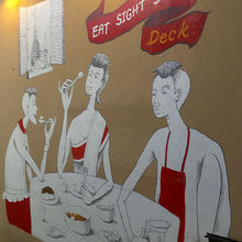 壁にはレストランの名前の由来がイラストで説明されている