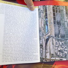 聖ランベルティ教会の塔と三つの鉄籠の冊子