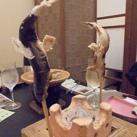 夕食　串に刺さったアユの塩焼き