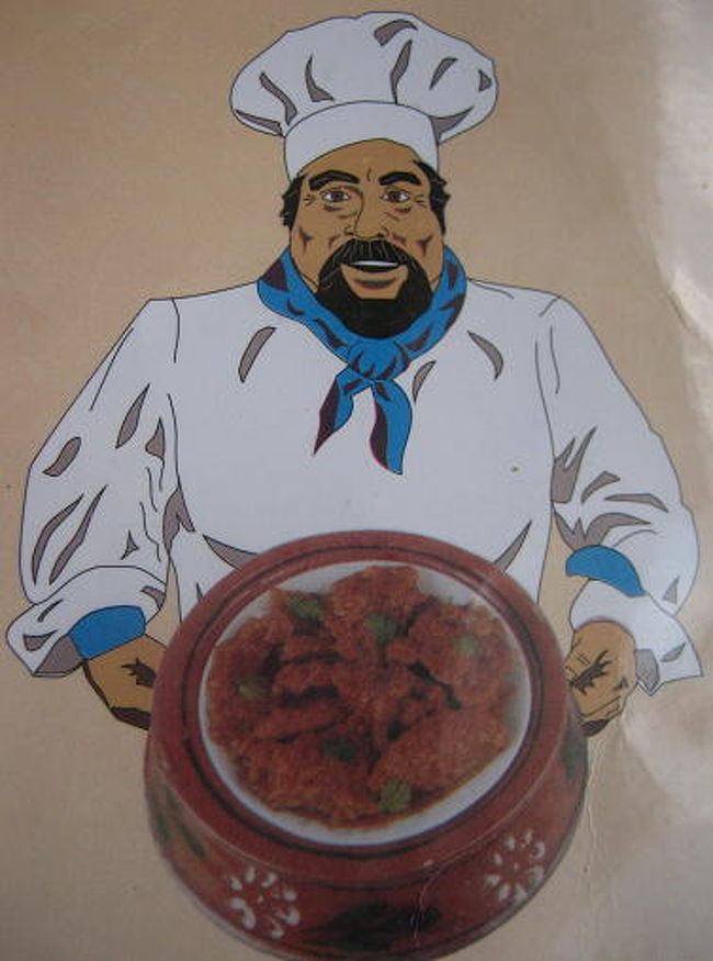 <br />コックがハンディをかかえている絵