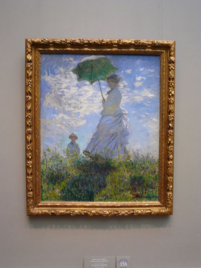 参考：1875年の第１作の「日傘をさす女（散歩）」です。米国ワシントンＤＣのナショナルミュージアム<br /><br />妻カミール・モネがモデルといわれている。
