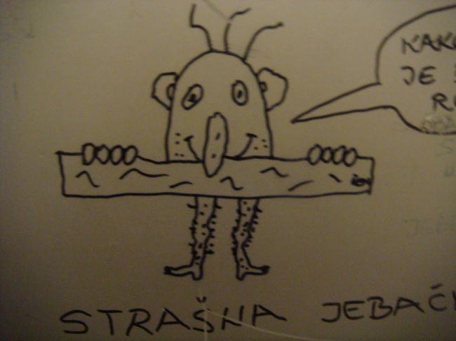 途中ドライブインで見たトイレの壁のらくがき！