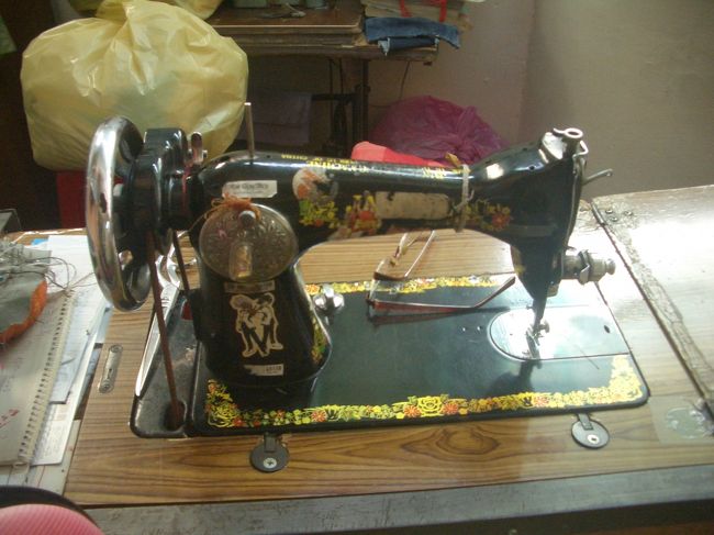 階段脇のたけ直し屋