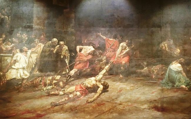 もうひとつは Juan Luna ( ファン・ルナ / 1857〜1899 ）の Spoliarium (スポリアリウム )（1884）である。この絵は古代ローマの競技場の地下死体置き場で、亡くなった競技者の死体を運び出している場面をえがいた作品である。<br /><br />フェリックス・レスレクミオン・イダルゴとファン・ルナはフィリピン人として初めて西洋の画壇に認められた画家で、この国の美術史に大きな足跡を残した。