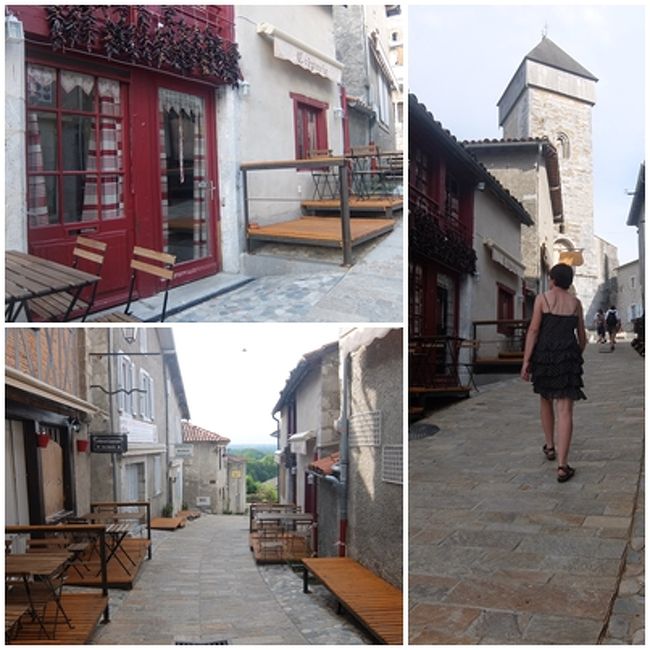 村の雰囲気に似つかわしくない女性が入った、大聖堂前の一本道のショット。<br />バスク地方の町の産物「唐辛子」が窓辺に干してある～