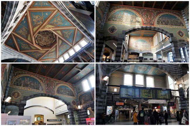 通路を抜けて出口に向かってビックリ。<br />なんとまぁ、見事な壁画！<br />色合いが独特。　どことなくビザンチンっぽい？<br /><br />壁画に囲まれたスペースにある列車の電光掲示板。<br />この新旧の混在がゲントを象徴していると、後からわかります。