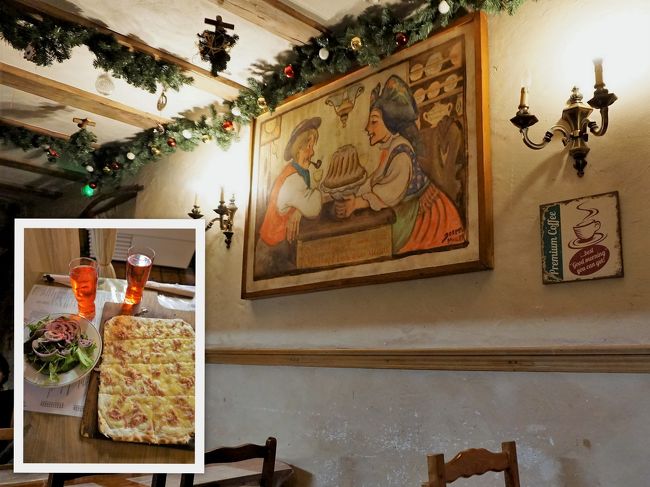 18：15、お腹は空かないけれど、一休みしましょう。<br />旧税関前の小さなカフェ”Alsako”に入りました。<br /><br />ユリアさんは”タルト・フランベ”を注文。アルザス名物の薄いピザ。<br />ぶどう畑はビタミンC補給しようと、グリーンサラダにしました。<br />サラダ好きではないものの、これは美味しかった！<br /><br />「タルト・フランベ、手伝って」とユリアさん。<br />お言葉に甘えていただきます。これも二重マル！<br /><br />アルザスでタルト・フランベといえば、名物の”マンステール・チーズ”がかかっているのですが、この店はチーズが選べて、ユリアさんはグリュイエールをチョイス。<br />正直言うと、マンステール・チーズは飽きてくるのですよね。<br />マンステールほど癖のないグリュイエールのフランベもいいね！<br /><br />白状します。ぶどう畑、この店で失敗をやらかしました。<br />トイレにバッグを忘れ、ではお会計という時に気がついた。（*o*）<br />焦りました～！<br />幸いにも、トイレにそのままあって、何事もなく。<br />風邪で少しボーっとしていたようです。危ない、危ない…。