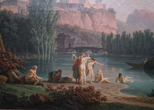 「夏の夕べ、イタリア風景」（部分拡大）<br />画面には、川辺で水浴びをする人々を点景に、夏の長い一日が暮れようとする時刻の風景が表わされています。右側の大きな岩と樹、画面の中心を占める川と橋などはヴェルネの作品にしばしば見られる道具立てです。遠景となっている町の風景は現時点では特定できず、いくつかの実景の組み合わせでしょう。